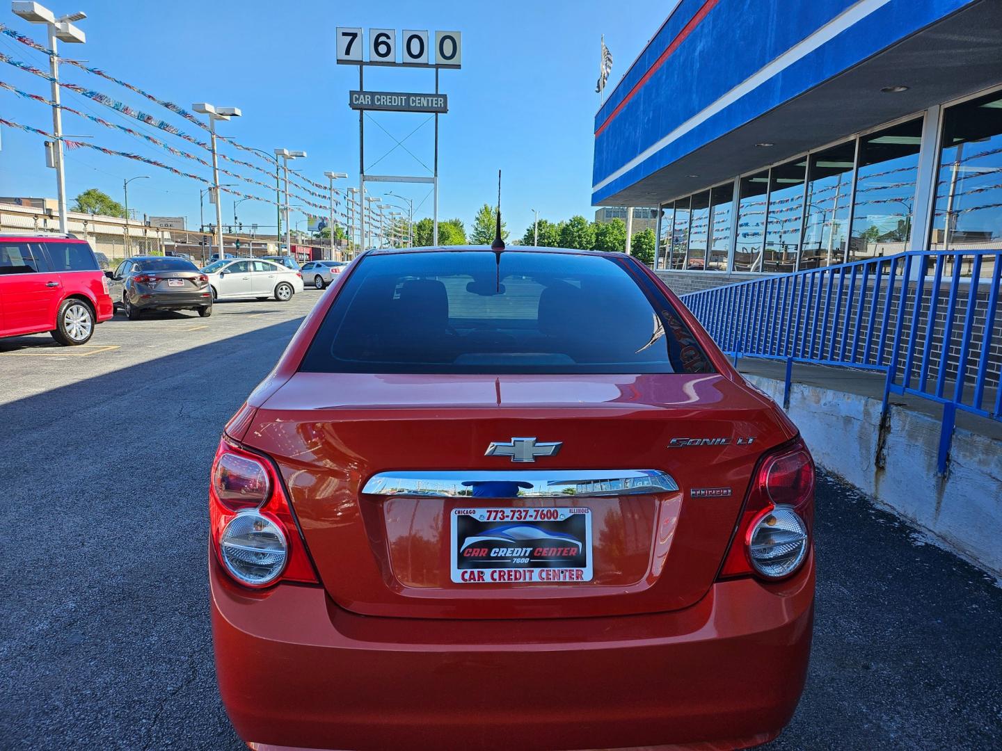 2012 ORANGE Chevrolet Sonic 1LT Sedan (1G1JD5SB8C4) with an 1.4L L4 DOHC 24V TURBO FFV engine, located at 7600 S Western Ave., Chicago, IL, 60620, (773) 918-3980, 0.000000, 0.000000 - Photo#3